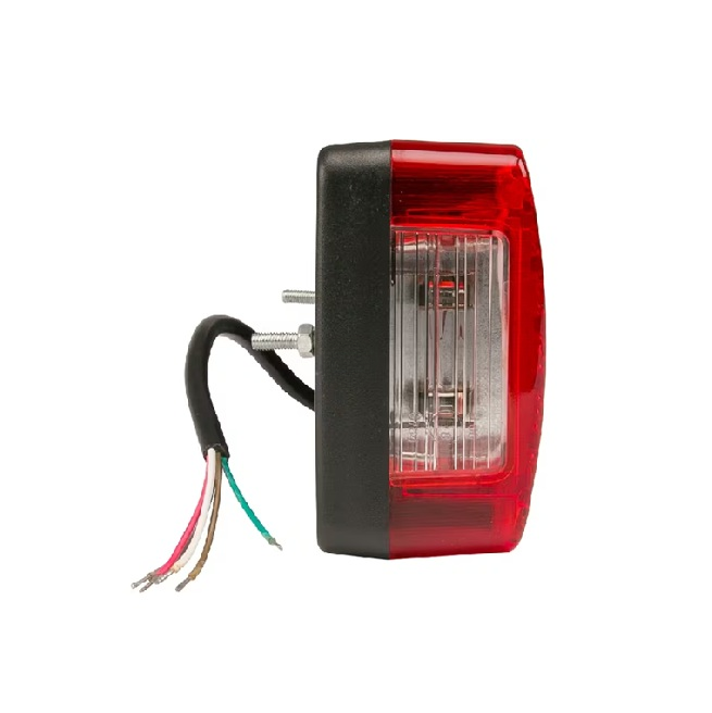 Detaliu lampă spate halogen dreapta cu lentilă roșie și sistem montare pe șurub pentru vehicule agricole